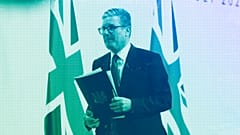 UK Prime Minister Keir Starmer walks off stage after speaking at a press conference during the European Political Community summit at Blenheim Palace, July 2024