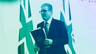 UK Prime Minister Keir Starmer walks off stage after speaking at a press conference during the European Political Community summit at Blenheim Palace, July 2024