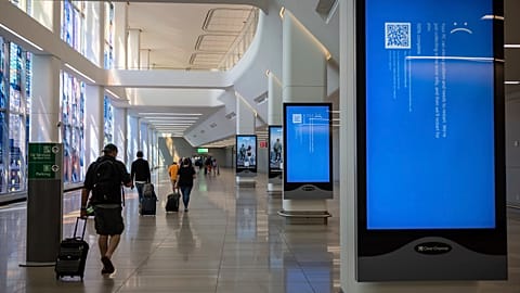 Screens show a blue error message at a departure floor of LaGuardia Airport in New York on Friday, July 19, 2024, after the Crowdstrike outage.