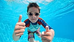 Being hydrated is much more important than not eating before going swimming.