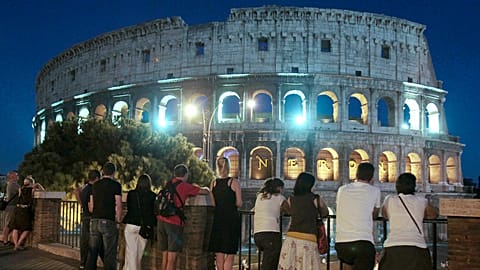 FILE - Rome's Colosseum at night, Italy, 2011