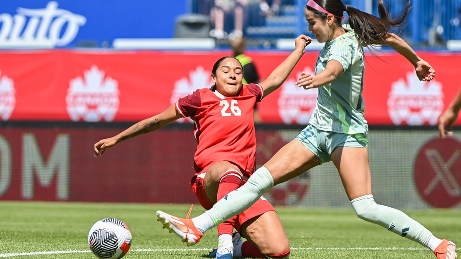 Mexico's Greta Espinoza, right, challenges Canada's Olivia Smith (26) during the first half of an international friendly soccer game in Montreal, Saturday, June 1, 2024
