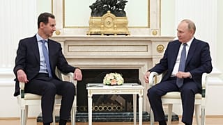 Syrian President Bashar Assad, left, and Russian President Vladimir Putin pose during their meeting in Moscow, Russia, Wednesday, July 24, 2024.