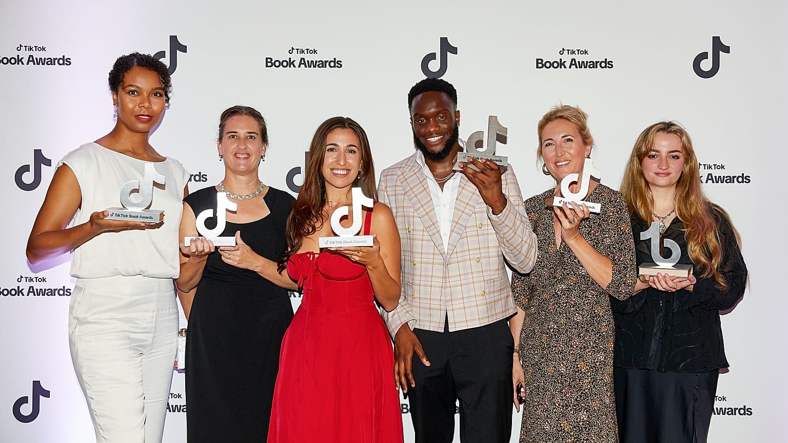 Talia Hibbert, Laurie Gilmore, Freya Blyth (The Bookshop by the Sea), John-Paul Kunrunmi, Lisa Jewell, and Maisie Matilda pose with their trophies