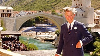 Britain's Prince of Wales stands at a viewpoint near the rebuilt Old Bridge in Mostar, Bosnia Friday July 23, 2004.