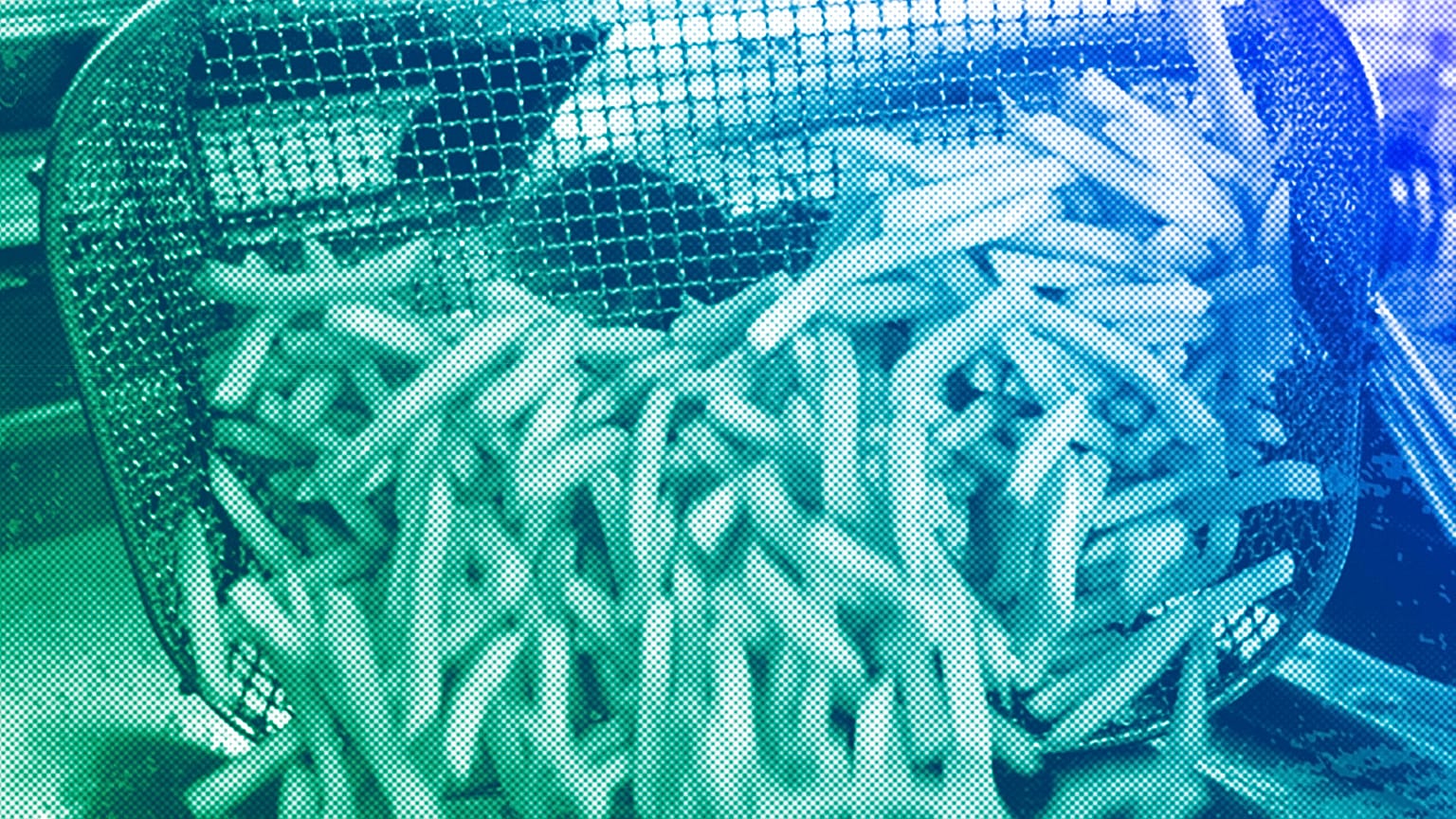 An employee prepares french fries in a fast food shop in Cologne, October 2009