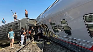 passengers are seen at a place of the derailment of a passenger train in Kotelnikovo, about 1200km south of Moscow, Volgograd region, 29 July 2024
