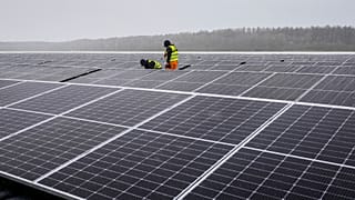 Solar panels are installed at a floating photovoltaic plant on a lake in Haltern, Germany.