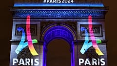 2024 Paris Olympics logo displayed on Arc de Triomphe