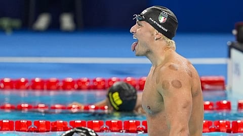 Nicolo Martinenghi, of Italy, celebrates after winning the men's 100-meter breaststroke final at the 2024 Summer Olympics.