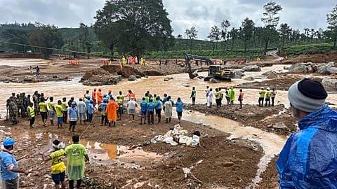 Rescuers stand near a bridge that got washed away in Tuesday’s landslides at Chooralmala, Wayanad district, Kerala state, India, Wednesday, July 31, 2024. 