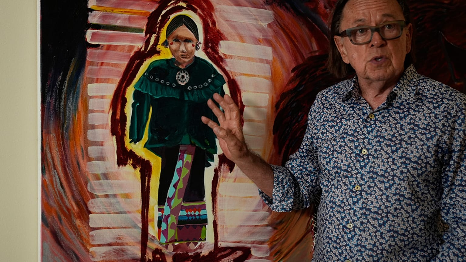 Joe Baker, a member of the Delaware Tribe of Indians and co-founder of the Lenape Center stands next to a painting of an Ohtas during an interview in his home in New York.