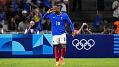 France's Alexandre Lacazette celebrates after scoring his side's first goal during the men's Group A football match between France and the United States