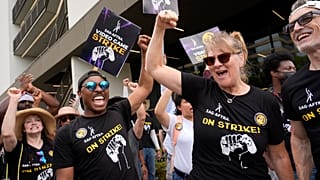 People take part in the SAG-AFTRA video game strike at Warner Bros. Games headquarters in Burbank, California on 1 August 2024.