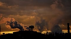Smoke rises from the chimneys of the Tenaris steel mill factory, in Dalmine, northern Italy, Wednesday, Feb. 10, 2021.