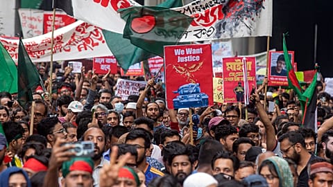 Activists take part in a protest march against Prime Minister Sheikh Hasina.