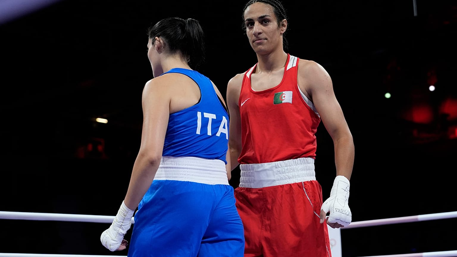 Algeria's Imane Khelif, right, walks beside Italy's Angela Carini after their women's 66kg preliminary boxing match at the 2024 Summer Olympics