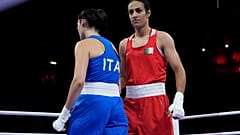 Algeria's Imane Khelif, right, walks beside Italy's Angela Carini after their women's 66kg preliminary boxing match at the 2024 Summer Olympics