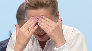 FILE: Denmark PM Mette Frederiksen reacts just before the start of the first plenary session at the European Political Community meeting in Blenheim Palace, 18 July 2024