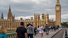 People walk on Westminster Bridge in London.