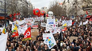 Protestors march in Paris over a proposed raise in the retirement age. Dec. 17, 2019.