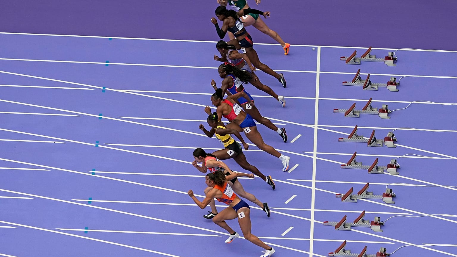 Athletes start in a women's 100-meter hurdles semifinal at the 2024 Summer Olympics, Friday, Aug. 9, 2024, in Saint-Denis, France.
