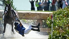 Ecuador's Ronald Zabala G., fall off their horse during the Equestrian Cross Country competition at Chateau de Versailles on July 28, 2024