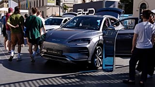 Visitors watch a BYD Seal U car at the IAA motor show in Munich, Germany, Friday, Sept. 8, 2023.