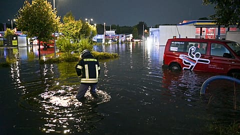 Rain flooded a service station in Aurich, Germany.