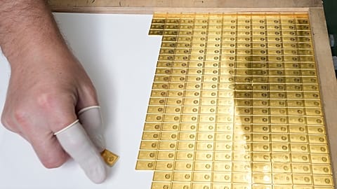 Investment gold bars being arranged for storage at the Mint of Poland, in Warsaw, Poland