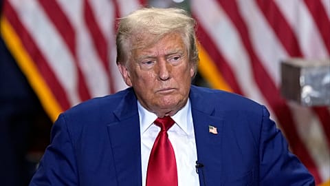 Republican presidential nominee former President Donald Trump listens at a business roundtable discussion at a campaign event at Precision Components Group