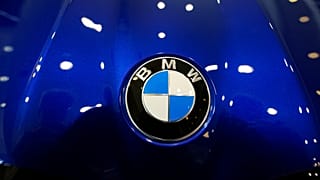 The company logo shines on the hood of an unsold vehicle at a Mini Honda BMW dealership on July 22, 2024, in Highlands Ranch.