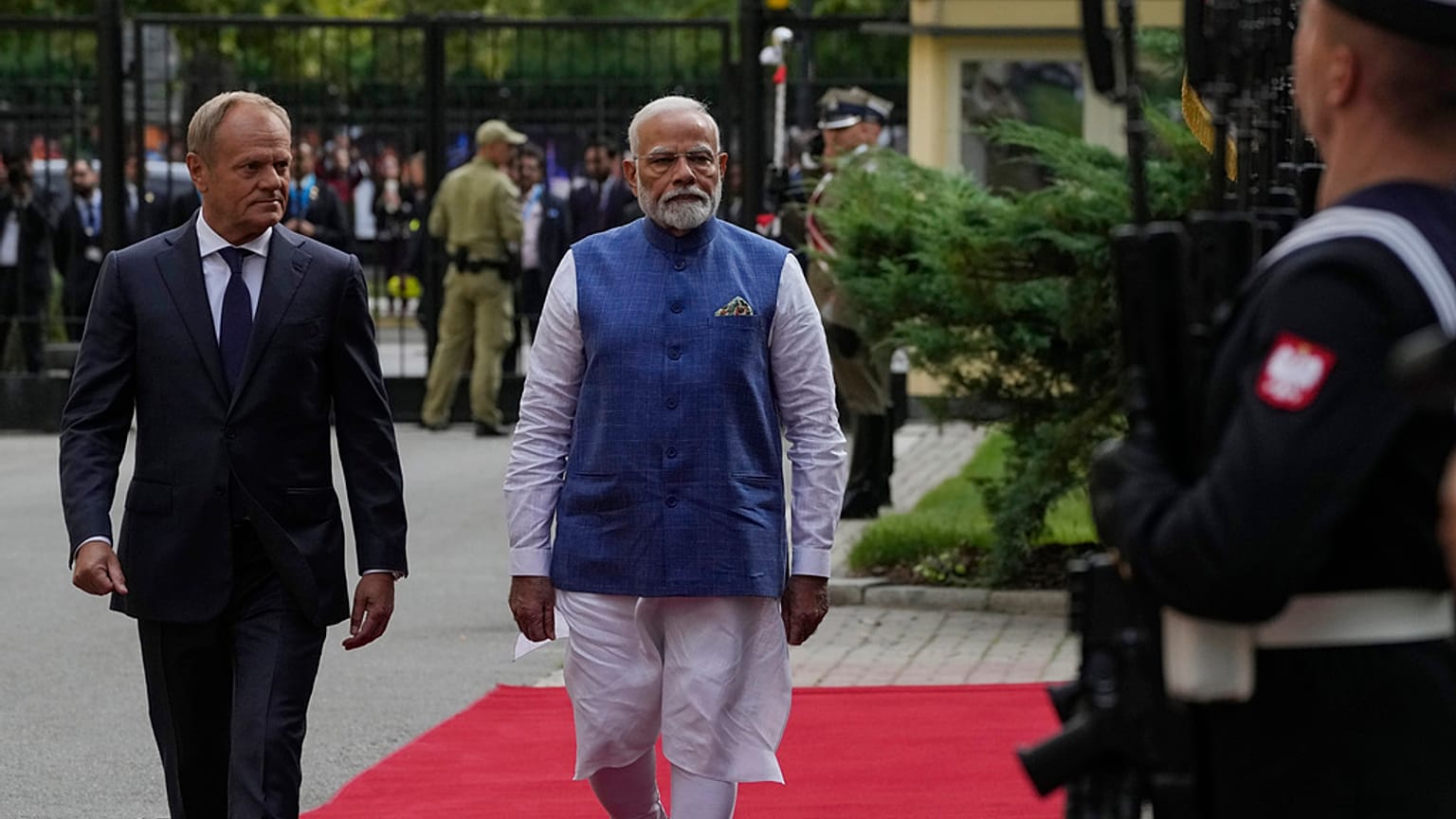 Indian Prime Minister Narendra Modi, right, walks with his Polish counterpart Donald Tusk, to inspect an honour guard before talks in Warsaw, Poland, Thursday, Aug. 22, 2024.