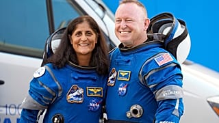 NASA astronauts Suni Williams, left, and Butch Wilmore stand together for a photo enroute to the launch pad.
