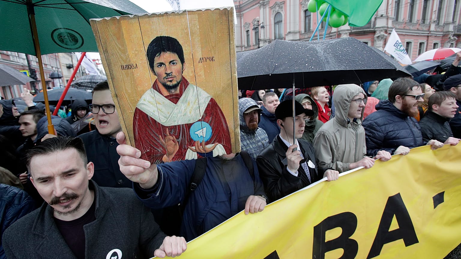 Protesters hold a portrait of messaging app Telegram co-founder Pavel Durov, 2018.