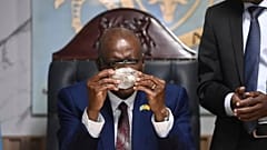 Botswana's President Mokgweetsi Masisi holds the 2,492-carat diamond that was unearthed at one of its mines