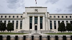 An American flag flies over the Federal Reserve building, Tuesday, May 4, 2021, in Washington.