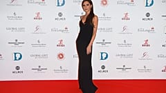 Victoria Beckham poses for photographers upon arrival at the Global Gift Gala 2015 in London, Monday, Nov. 30, 2015.