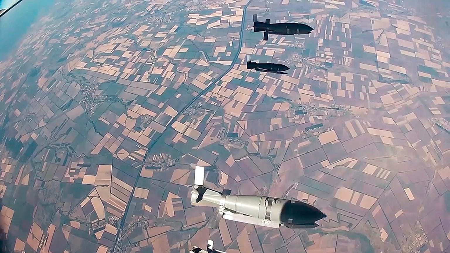 FILE - In this photo taken from video released by the Russian Defence Ministry on Aug. 21, 2024, glide bombs are released by a Russian warplane en route to their targets