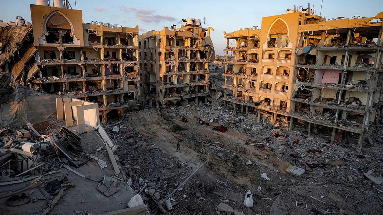 Palestinians inspect their houses after being destroyed byIsraeli bombardment on east of Deir al-Balah, Thursday, Aug. 29, 2024.