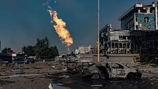 Gas burns in front of a business center damaged by a Russian attack in Kharkiv, Ukraine, Sunday, Sept. 1 2024.