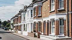 Row of typical British terraced houses in Barnes, an affluent residential area of London, famous for its village atomosphere.