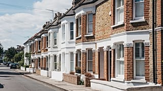 Row of typical British terraced houses in Barnes, an affluent residential area of London, famous for its village atomosphere.