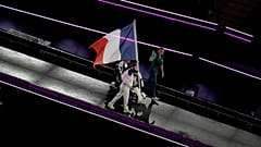 Members of the French delegation parade during the closing ceremony of the 2024 Paralympics in Paris, 8 September 2024