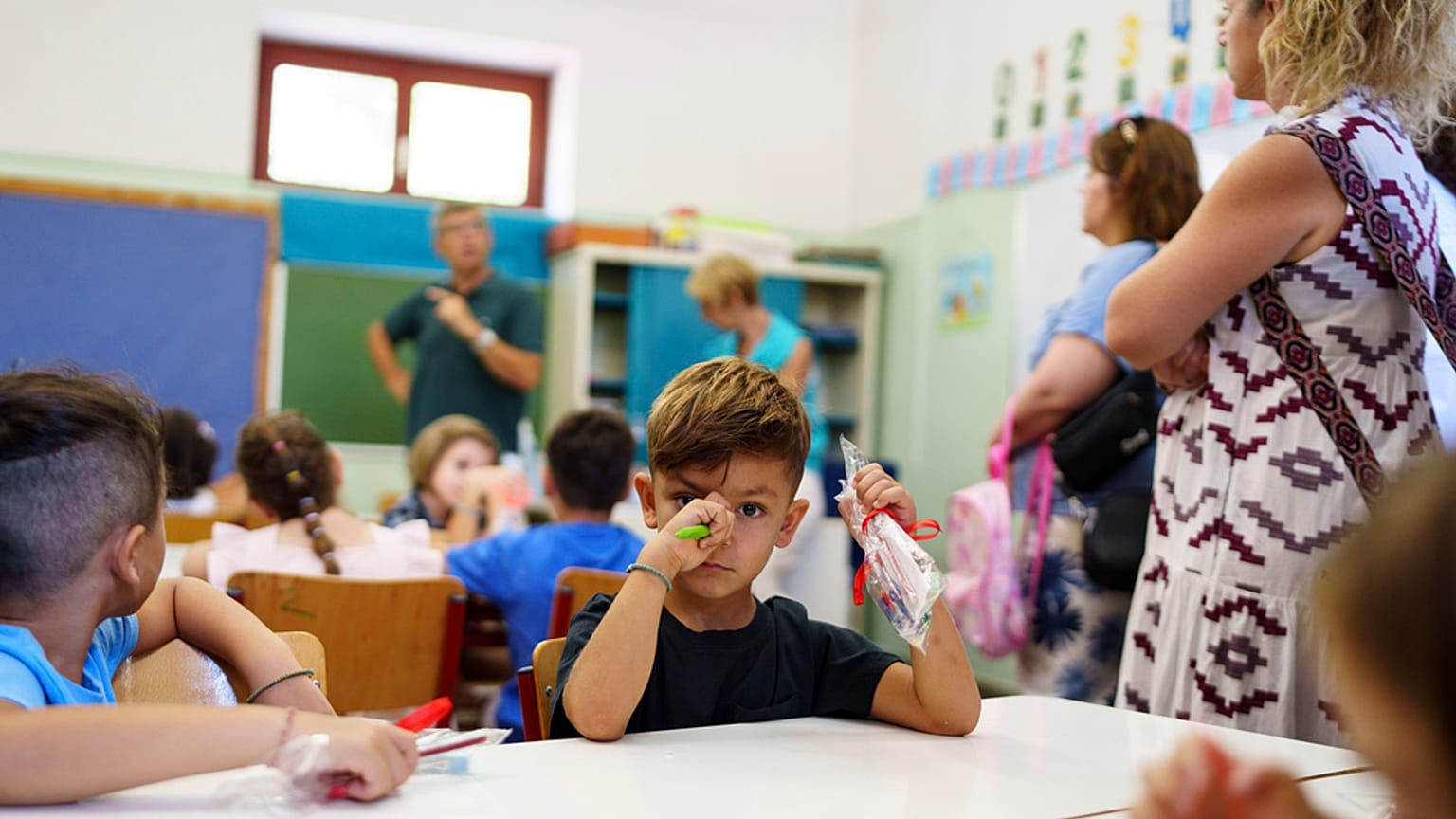 Filippos and other students attend the first day of school at a public elementary school in Athens, on Wednesday, Sept. 11, 2024. 