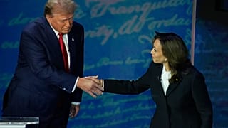 Republican presidential nominee former President Donald Trump shakes hands with Democratic presidential nominee Vice President Kamala Harris 
