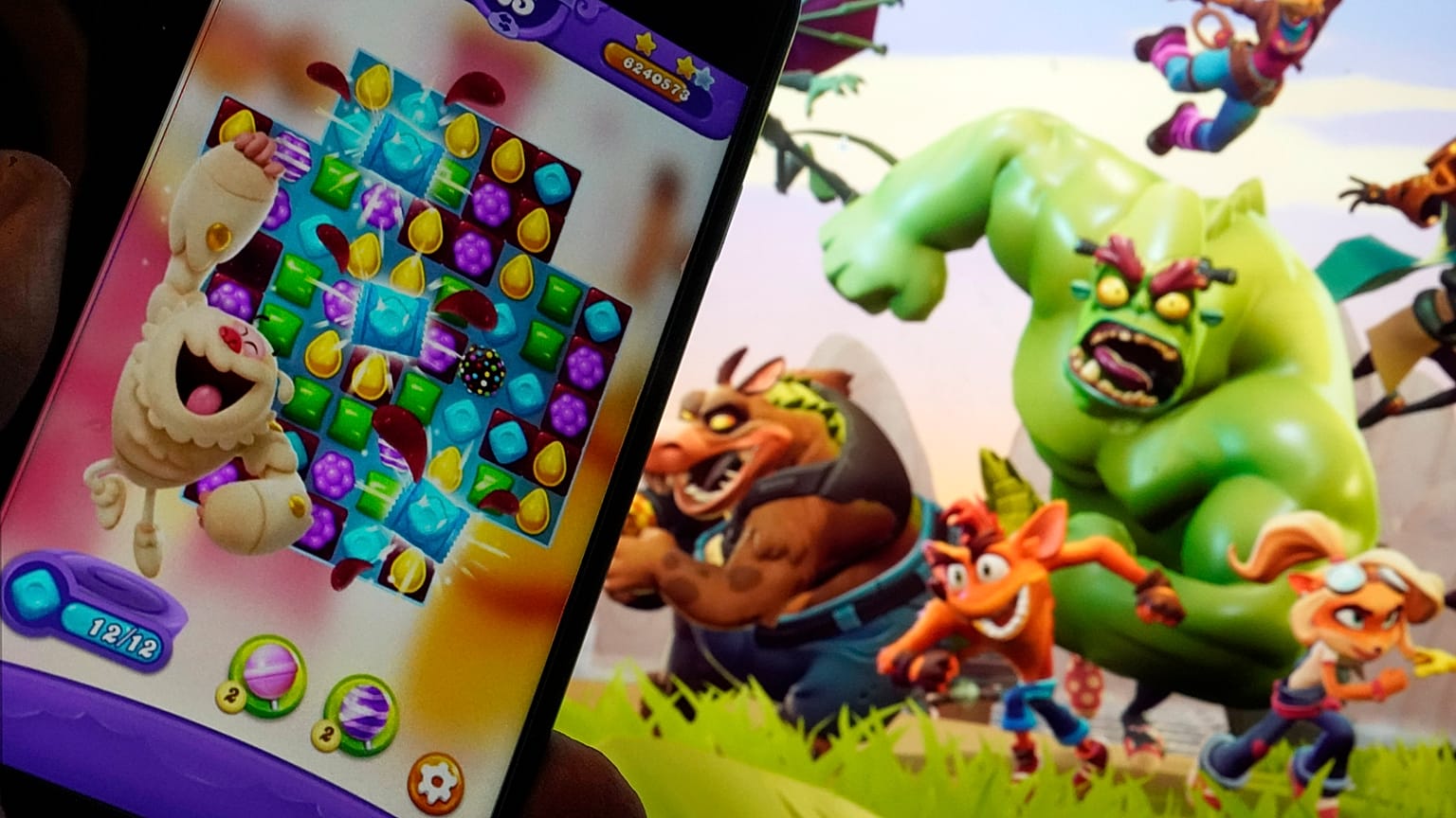 Scenes from "Candy Crush Saga," left, by Activision Blizzard, and "Crash Team Rumble," from Activision Publishing, in New York, Wednesday, June 21, 2023.