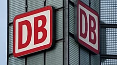 Two logos of the 'Deutsche Bahn' (German Railroad) are pictured at the main train station in Berlin, Germany. 3 January 2022.