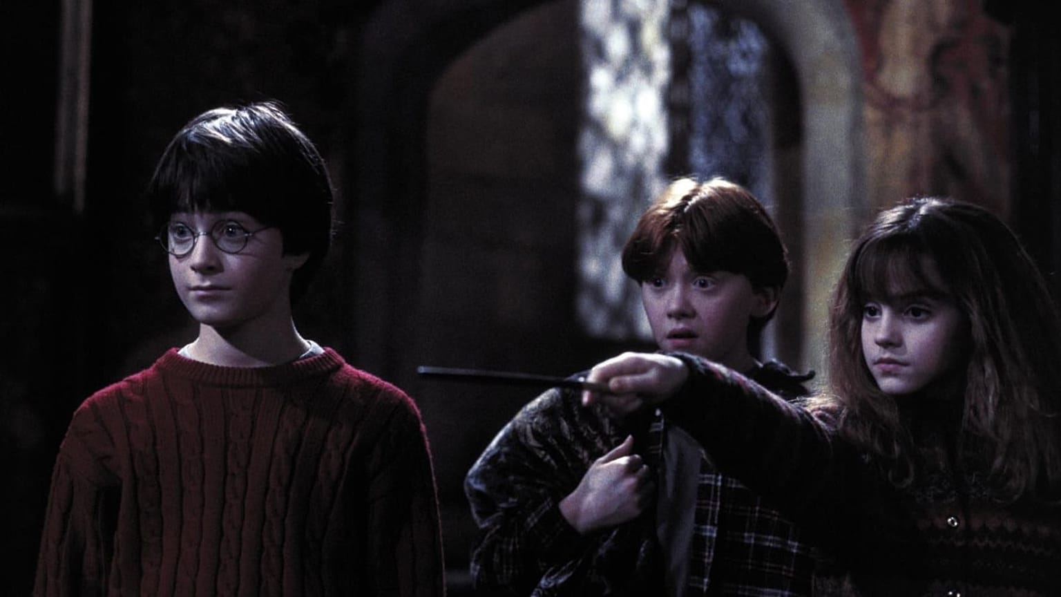 Rupert Grint, Daniel Radcliffe e Emma Watson em 'Harry Potter e a Pedra Filosofal' 