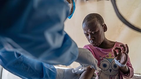 FILE - A health worker attends to an mpox patient, at a treatment center in Munigi, eastern Congo, Aug. 19, 2024.